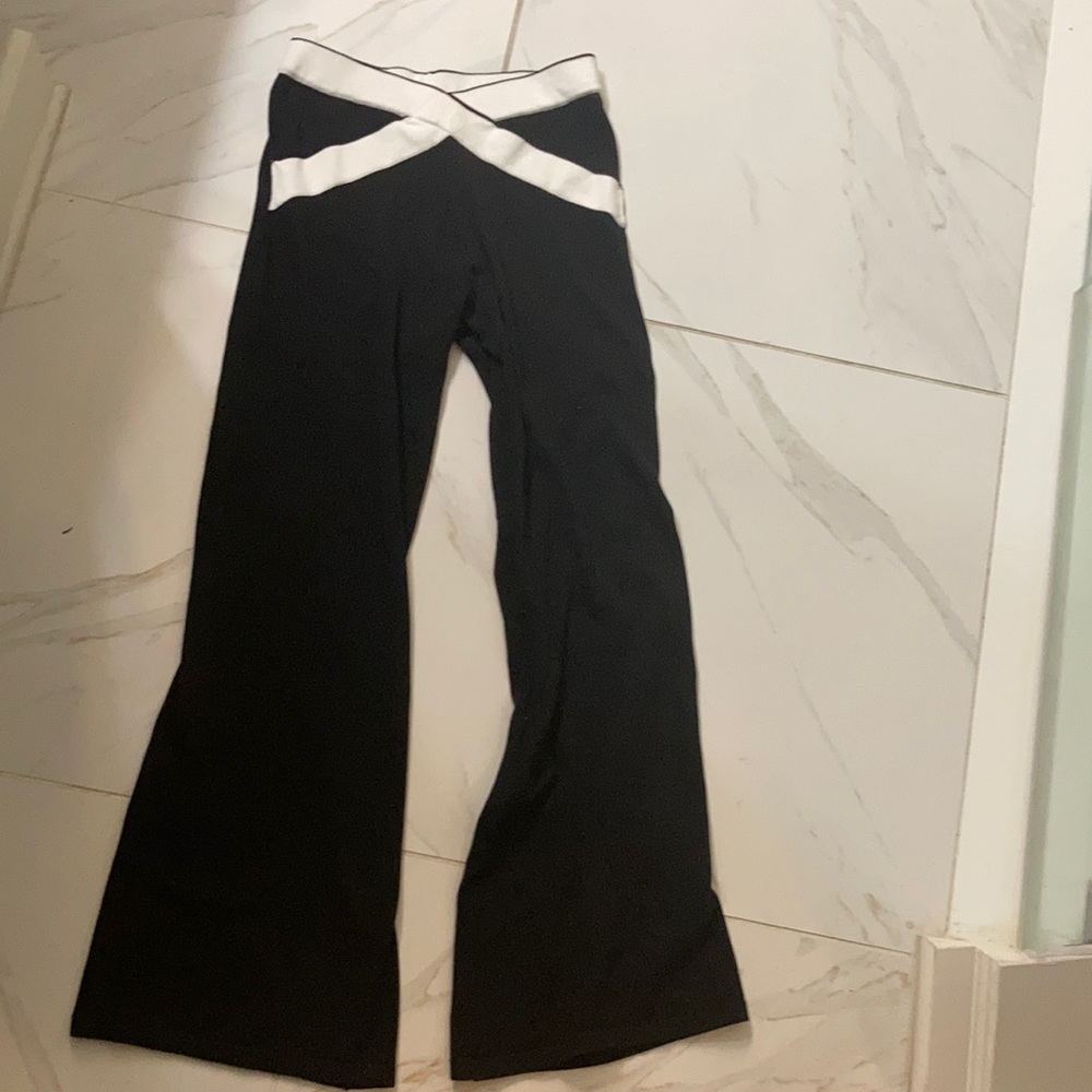 White crisscross black pants